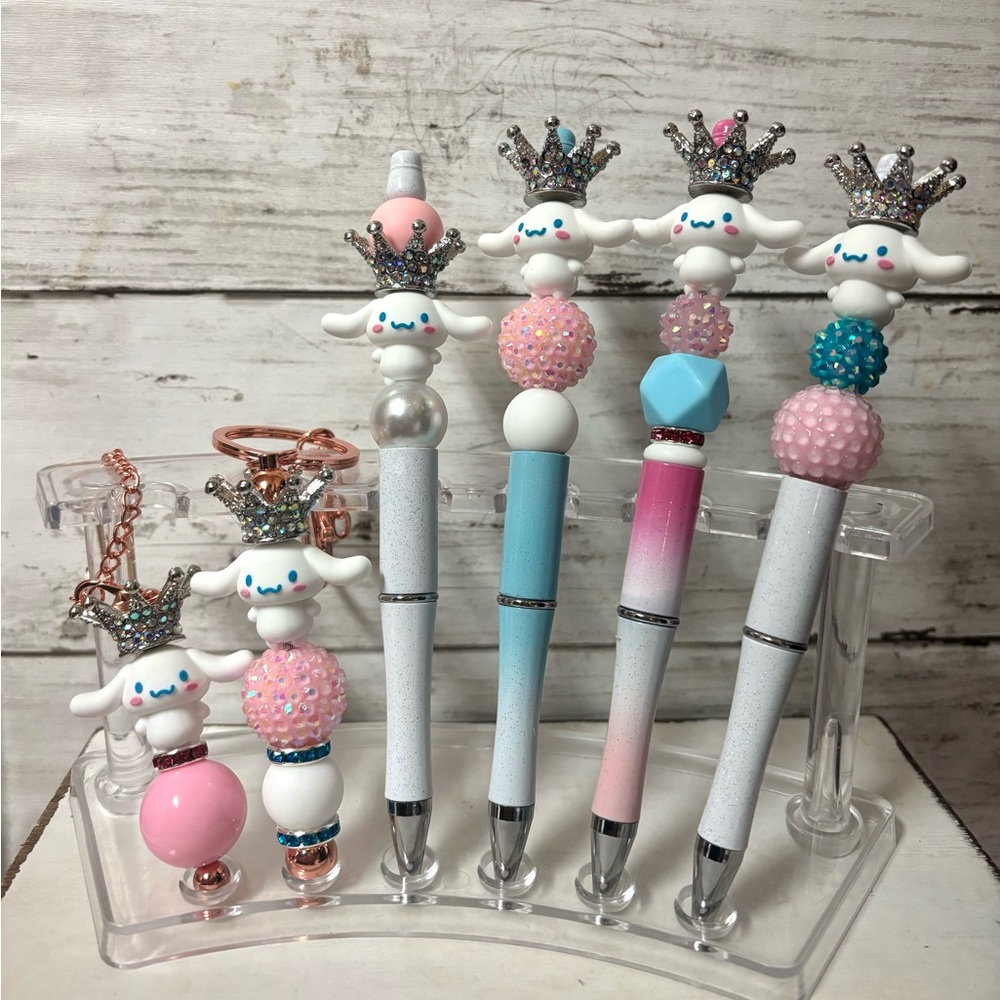 Sanrio cinnamon roll pens, keychains, and Stanley charms